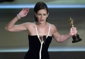 Actress Julia Roberts holds her Oscar for Best Act